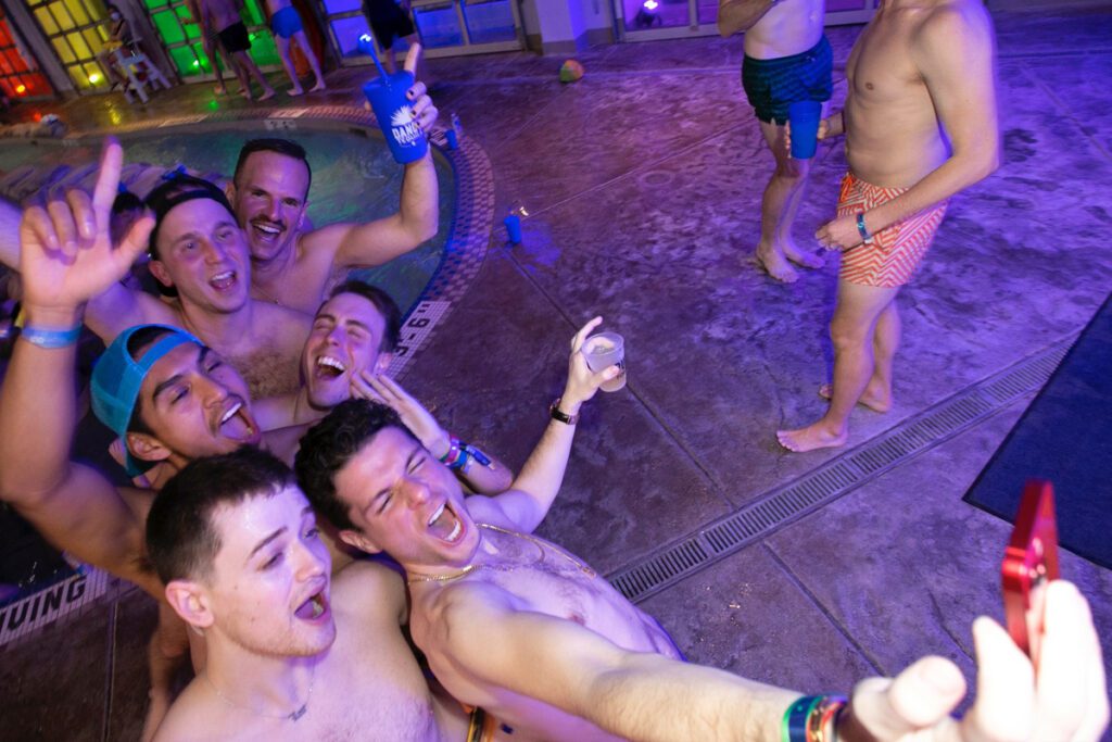 A group of men enjoy Aspen Gay Ski Week.