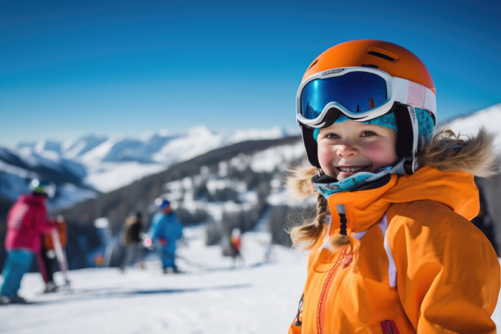 A young boy in a ski gear