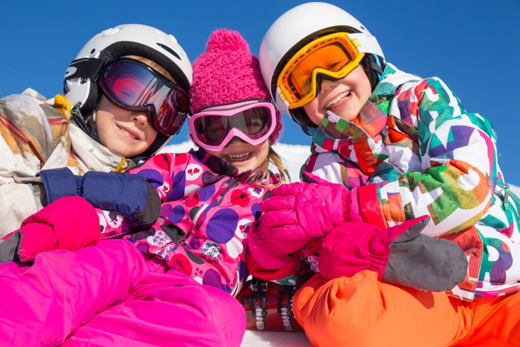 Small skiers in colorful clothes