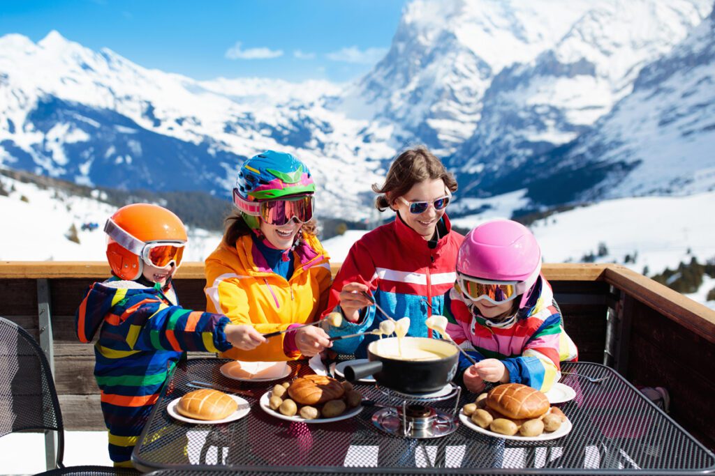 A family enjoys a slopeside meal.