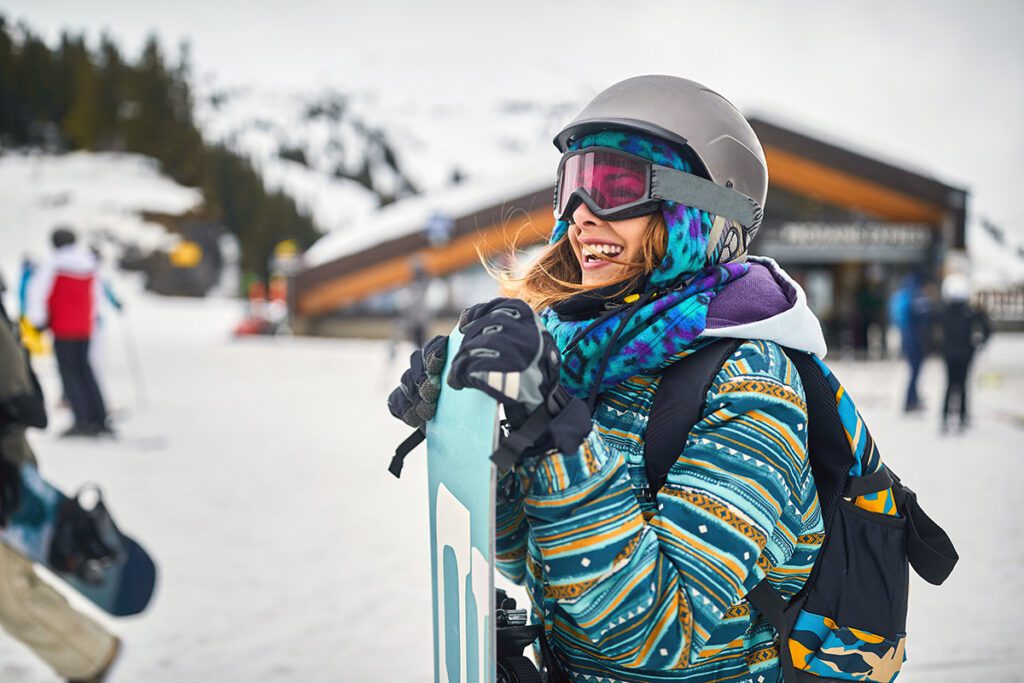 smiling female snowboarder
