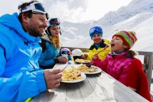 family-eating-lunch-on-the-mountain