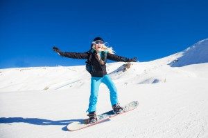 female-snowboarder-slide-downhill