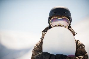 person-holding-snowboard-close-up