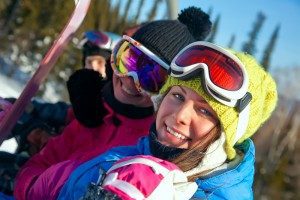 snowboarders-smiling-on-chairlift-closeup