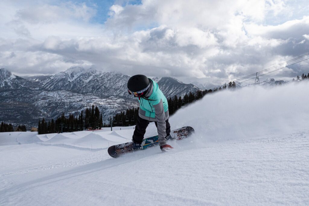 A man snowboards at Purgatory ski resort.