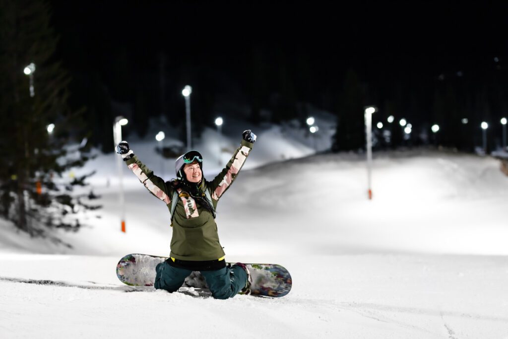 A snowboarder night skiing in Colorado.