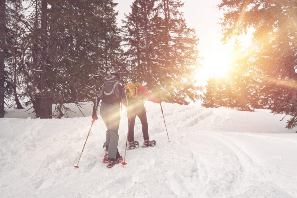 A couple snowshoeing in the Colorado mountains