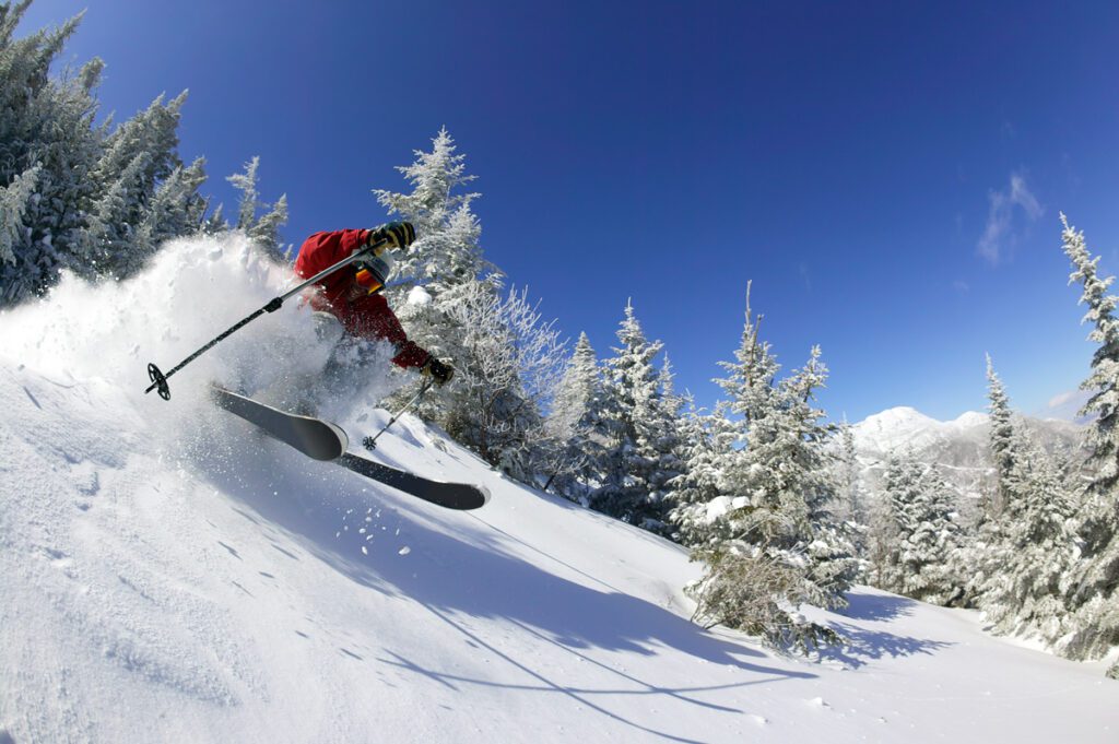 A man skis on a vermont winter getaway to Stowe