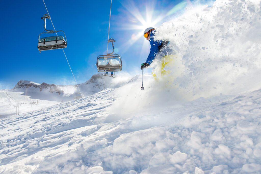 A skier plows through fresh powder