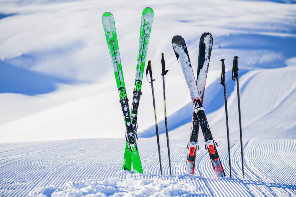 skis stand vertically in the snow