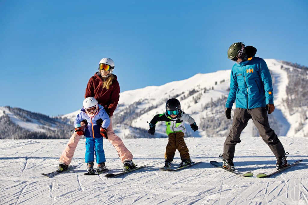 A family skis down a trail at Sun Valley Resort.