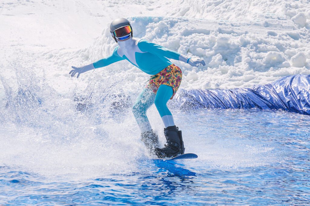 A man pond skims during a spring ski event.