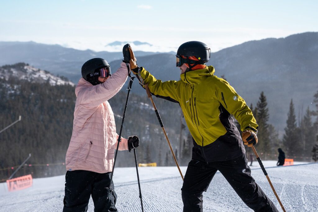 skiers high five